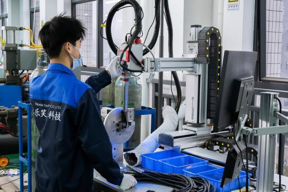 Operator at fixtured assembly equipment